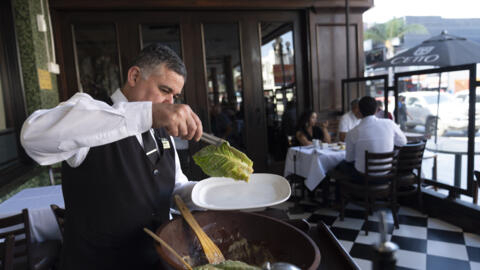 Salad Master Efrain Montoya prepares a Caesar salad at Ceasar's restaurant Thursday, June 27, 2024, in Tijuana, Mexico. Caesar salad has something to celebrate: It's turning 100. Italian immigrant Cae