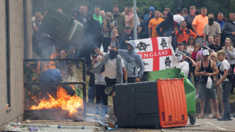 Anti-immigrant protesters in Rotherham, Britain, 4 August 2024. Violent protests have continued around the UK, as Prime Keir Starmer warned participants they would face swift legal penalties.