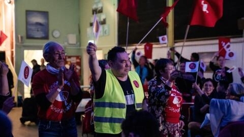 Members of Greenland's opposition Inuit Ataqatigiit party celebrate on election day in the capital Nuuk.