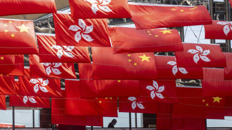 China and Hong Kong flags are hung as the city marks China's national day in Hong Kong, Sunday, Oct. 1, 2023.