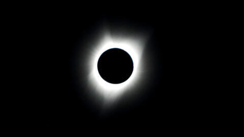 People watch the solar eclipse during the Lowell Observatory Solar Eclipse Experience at Madras High School in Madras, Oregon, U.S. August 21, 2017.