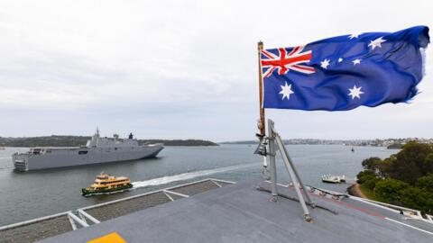 In this photo provided by the Australian Defense Force, HMAS Adelaide departs from Garden Island fleet base in Sydney, Australia, Monday, Jan. 17, 2022, to assist the Tonga government after the erupti