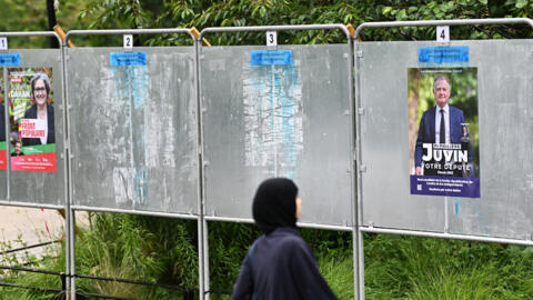 Campaign posters in Courbevoie, France, 21 June 2024.