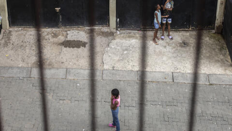 Children stand in a street in Alexandra township near Johannesburg on 9 March, 2024. Thirty years after the end of apartheid, South Africa suffers from one of the world's worst rates of income inequality. 