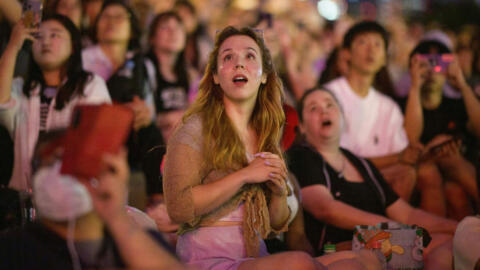 Fans of K-pop megastars BTS watch a firework display during the "BTS 10th Anniversary FESTA @ Yeouido" in Seoul on June 17, 2023, to mark the 10th anniversary of the group's debut.