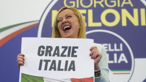 Far-right party Brothers of Italy's leader Giorgia Meloni shows a placard reading "Thank you Italy".