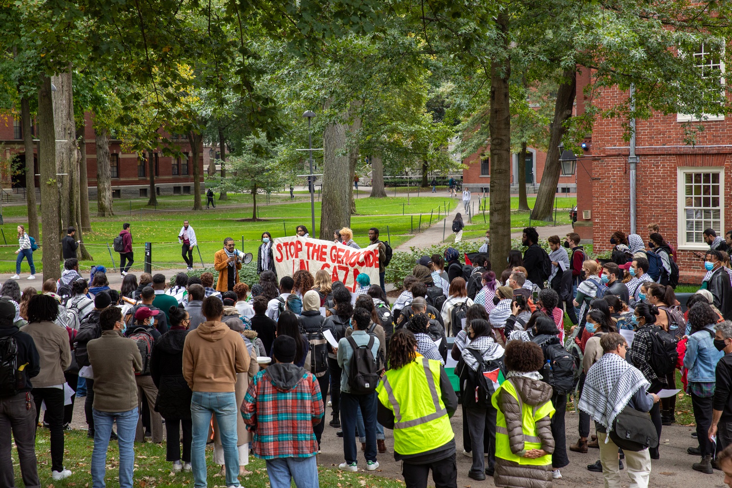 Pro-Palestine protesters gathered outside Massachusetts Hall, which houses the Harvard President's office, in October 2023. The terms of the University's Tuesday settlement of two antisemitism lawsuits sparked hope from some students and outrage from others.