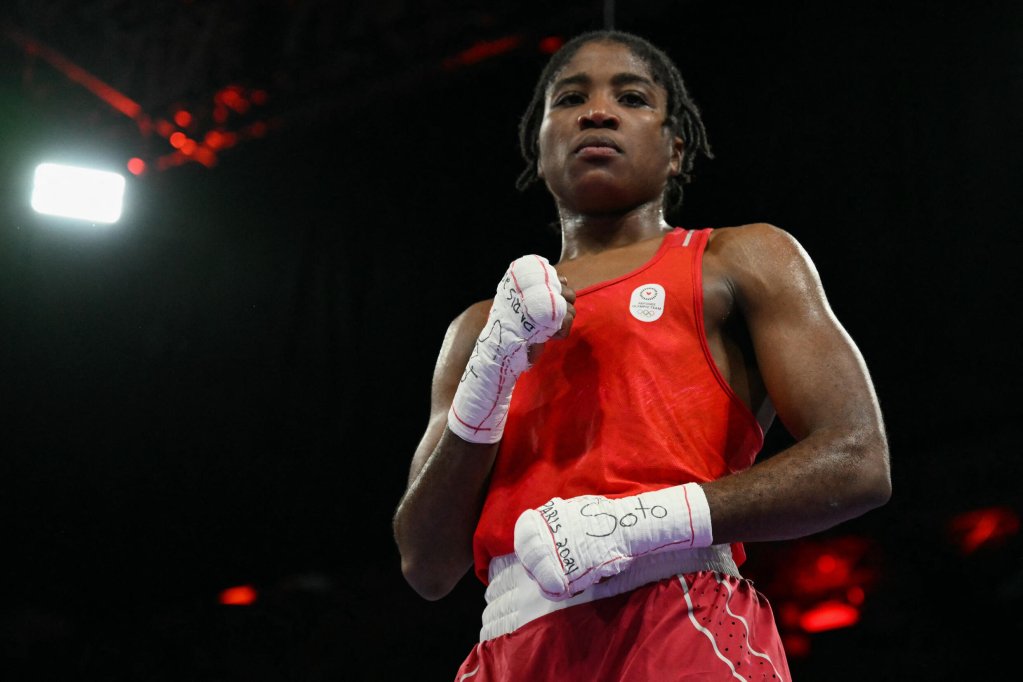 Boxer Cindy Ngamba, a member of the Refugee Olympic Team, after beating France's Davina Michel in the women's 75kg quarter-final match at the 2024 Olympic Games, at the North Paris Arena on August  4, 2024 | Photo: AFP / Mohd Rafsan