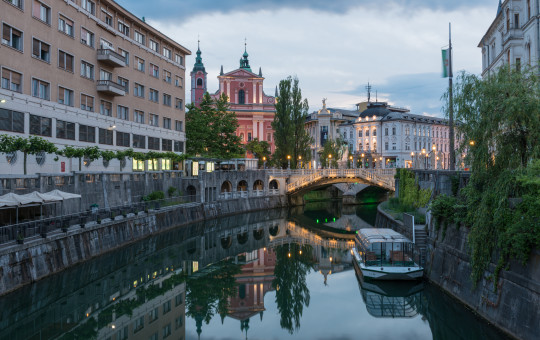 triple bridge boat on the river luka esenko