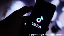 Illustration picture shows the logo of the social media or video network Tiktok (or Tik Tok) on the screen of a phone (smartphone) in Paris, France on March, 7, 2023. - The White House backed legislation introduced on Tuesday by a dozen senators to give the administration new powers to ban Chinese-owned video app TikTok and other foreign-based technologies if they pose national security threats. Photo by Victor Joly/ABACAPRESS.COM
