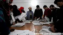 Polling staff count ballots at a polling station after polls closed, during the general election, in Lahore, Pakistan, February 8, 2024. REUTERS/Navesh Chitrakar 