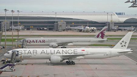 Singapore Airlines' Boeing 777-300ER aircraft, front, is parked after encountered severe turbulence, at Suvarnabhumi International Airport, Bangkok, Thailand, 22 May 2024. 