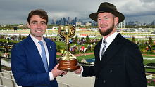 David Eustace and Ciaron Maher pose with the 2022 Melbourne Cup trophy after Gold Trip's victory