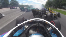 Josef Newgarden tips Colton Herta into a spin.