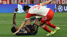 Bayern Munich's Minjae Kim brings down Real Madrid's Rodrygo in the penalty area, gifting the visitors a penalty kick.