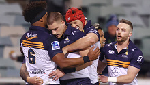 Brumbies players celebrate a try by Andy Muirhead.