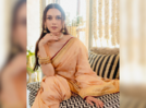 Aditi Rao Hydari spills subtle glam in an Ashrafi motif sari blended with beige hues