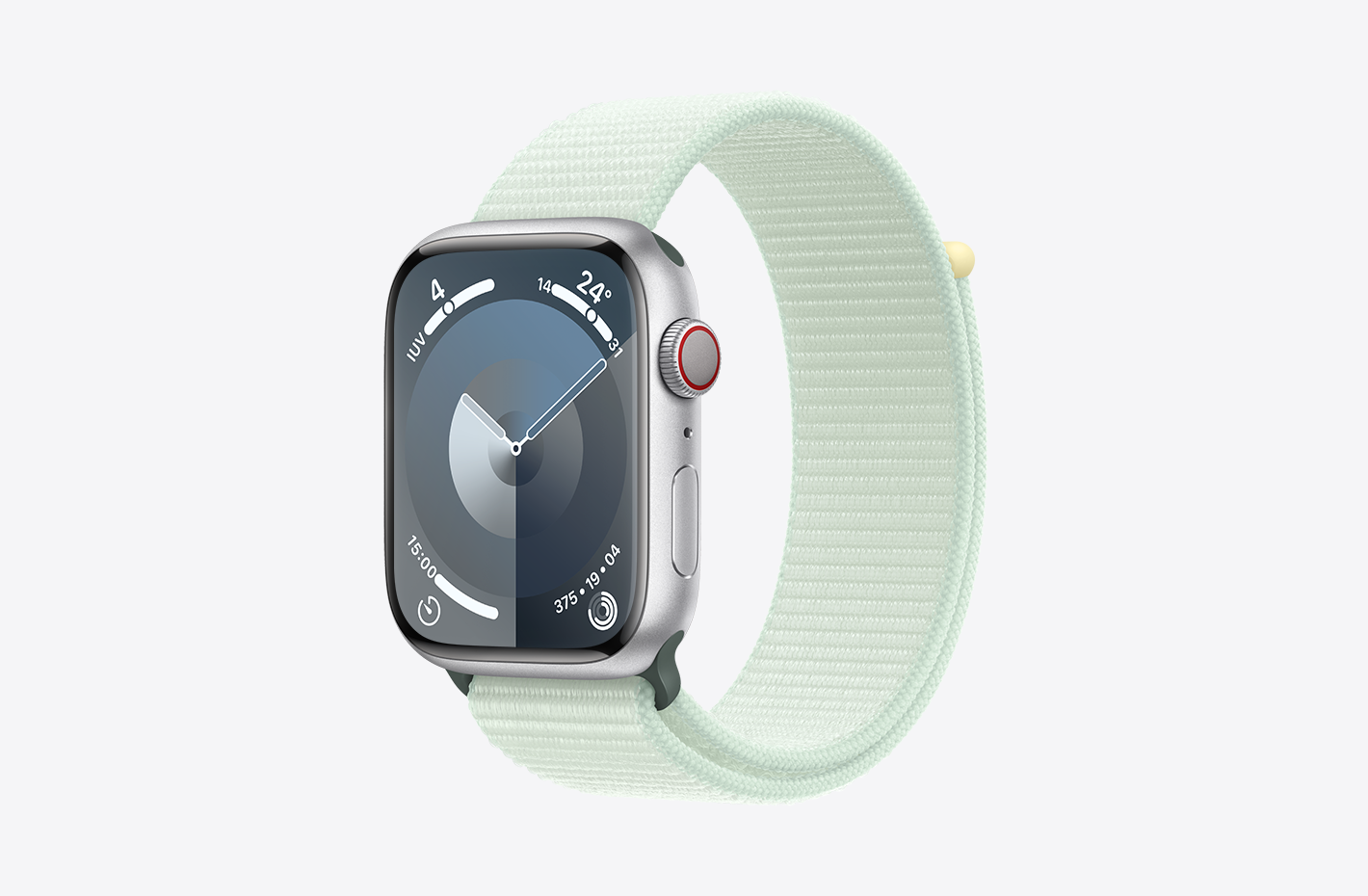 Apple Watch en aluminium argent au fini mat et vue de biais d’un bracelet sport à rabat menthe douce (vert) fait de nylon à double couche et doté d’une fermeture à rabat