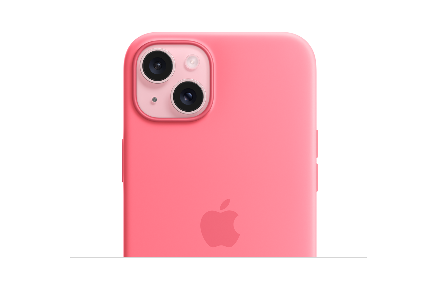 ピンクの仕上げのiPhone 15に装着したピンクのMagSafe対応シリコーンケース。中央にAppleのロゴ。カメラの部分がくり抜かれている。