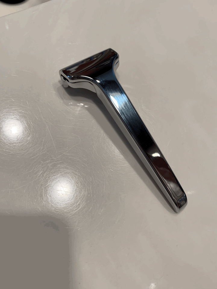 The Single Edge Razor laid on a shiny surface