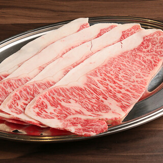 Enjoy Kuroge Wagyu beef sirloin Yakiniku (Grilled meat) in Sukiyaki style with egg yolk sauce.