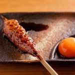 Yakitori Uzuki - 【つくね（卵黄付き）】
                      「日本一のこだわりの卵」の卵黄を使用。濃厚で新鮮な卵がつくねのたれと絡み合って、抜群の味わいです♪300円