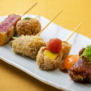 The specialty is "Beef Kushikatsu" (skewered cutlets). Beef loin, Kobe beef meatballs, Japanese black beef, and more.