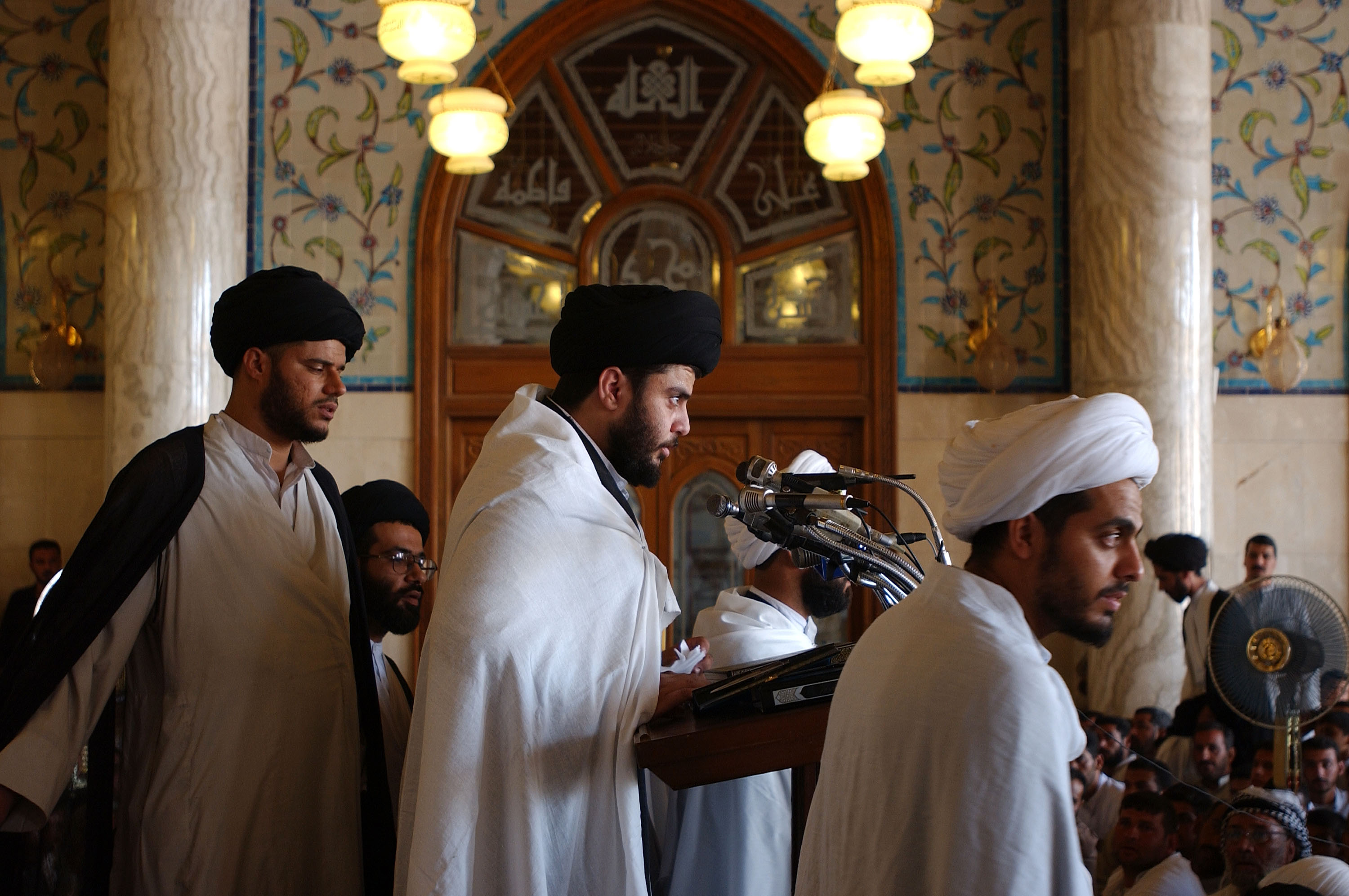 NAJAF, IRAQ - JULY 11:  Outspoken Iraqi sheikh Muqtada al-Sadr delivers Friday prayers on July 11, 2003, at the mosque in Kufa, near Najaf, where his father Mohamed Sadeq al-Sadr--one of Iraq's most respected clerics, who was killed by Baathists in 1999--first began giving sermons. The faithful line up in their thousands at the Kufa mosque to hear the cleric give a message of "wait and see," regarding the US occupation and new government of Iraq, and how Iraq's majority Shia Muslims should deal with it. Al-Sadr has also sparked a divide within Iraq's clerics, as he faces off with more moderate, and higher ranking religious leaders. (Photo by Scott Peterson/Getty Images)