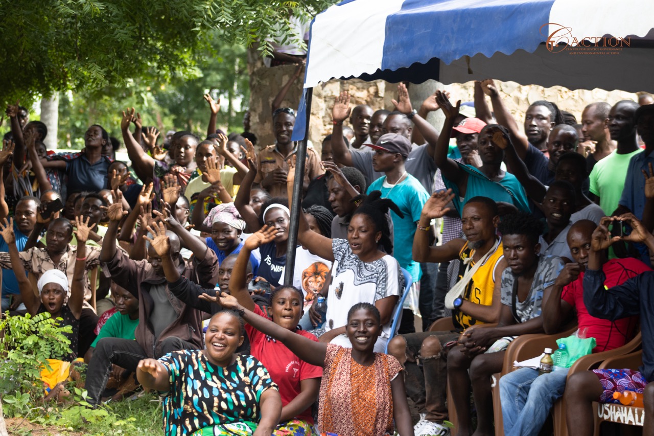 Uyombo community gathered in a meeting outside