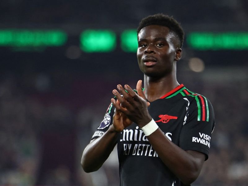 Arsenal midfielder Bukayo Saka applauds during the English Premier League football match between West Ham United and Arsenal at the London Stadium