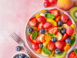 Fresh fruit salad in a bowl with fork