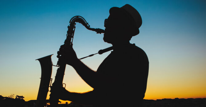 A musician at sunset