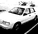 Et bilde av en Ford Tempo tatt med Game Boy Camera.