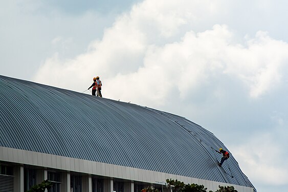 Workers installing roof on construction project of Light Rail Transit Station in Palembang, South Sumatera, Indonesia. Picture taken at Friday, 16 March 2018