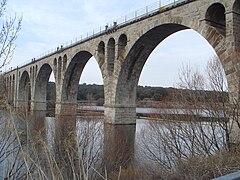 Stone arch railway bridge over Adaja river in Ávila