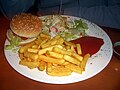 Veggie burger with fries and salad