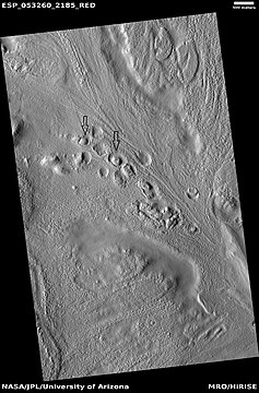 Row of mounds, as seen by HiRISE under HiWish program. Arrows point to some of the mounds.