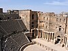 An overview of the stage and seating area in the Roman theatre in Bosra, Syria.