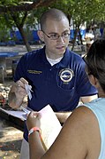US Navy 090627-F-7923S-062 Nicholas Berry administers medications from the pharmacy at Centro Escular Ramon Mendoza school during a Continuing Promise 2009 medical community service project.jpg