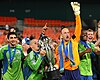 Sounders FC players lift the U.S. Open Cup trophy after winning the final.
