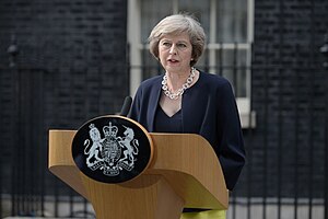 May in front of her lectern at 10 Downing Street