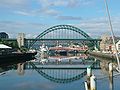 A through arch bridge (Tyne Bridge in Newcastle upon Tyne, England): parabolic-looking arches with multiple deck supports distributing the load