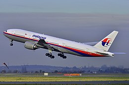 A Boeing 777 in Malaysia Airlines livery just after lifting off the runway