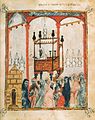 Miniatura de la Hagadá Barcelona de 1350, con el interior de una sinagoga y la lectura de la Torá; manuscrito sefardí miniado para Pésaj.[27]​