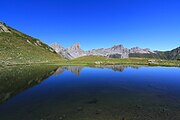 Aiguilles d'Ansabère and Mesa de los Tres Reyes reflected in the lake of Ansabère