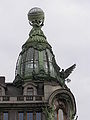 Finial figures and globe, Singer House. St. Petersburg, 1902–1904