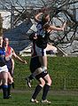 Girl takes a "specky" or "screamer" (high mark) over an opponent in the 2007 Victorian Women's Football League Grand Final