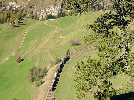 Southbound freight train heading for Plaz loop tunnel (view from footpath to Piz Darlux) Südwärts fahrender Güterzug auf dem Weg zum Plaz Kehrtunnel (Blick vom Fussweg zum Piz Darlux)