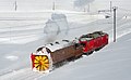 Een voertuig om de rails sneeuwvrij te maken