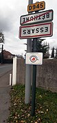 Upside-down signs marking the limit between Béthune and Essars.jpg